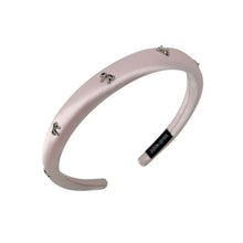 Load image into Gallery viewer, Pink headband with small bow decorative charms on a white background