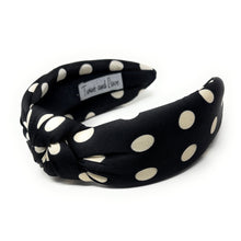Load image into Gallery viewer, Black headband with beige polka dots on a white background