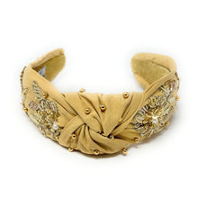 Load image into Gallery viewer, Beige headband with decorative elements on a white background