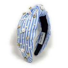 Load image into Gallery viewer, A stylish headband with blue and white stripes, adorned with pearls and sparkling gems. It has a knotted design, offering a chic and elegant look.