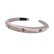 Load image into Gallery viewer, Pink headband with small silver bow decorative charms on a white background