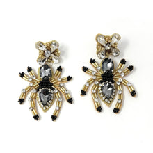 Load image into Gallery viewer, Halloween beaded Earrings, spider Earrings, halloween Earrings, spider Halloween Earrings, earrings for halloween, spider beaded earrings, spooky beaded earrings, spider jeweled earrings, Unique earrings, statement earrings, Halloween jewelry, spider earrings, unique jeweled earrings, spooky earrings, costume jewelry, Holiday earrings, custom earrings, custom designs, dangling earrings, lightweight earrings, halloween accessories, halloween vibes, spooky vibes, handmade gifts, handmade gifts, custom gifts
