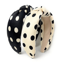 Load image into Gallery viewer, Two polka dot headbands, one black and white, one white and black, on a white background.