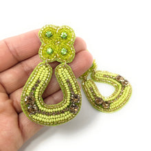 Load image into Gallery viewer, custom beaded Earrings, horseshoe Earrings, lion Beaded Earrings, green earrings, horseshoe jeweled earrings, women earrings, handmade earrings, custom earrings, bejeweled accessories, fancy accessories, St Patrick’s Day earrings, gifts for mom, best friend gifts, birthday gifts, bohemian earrings, St Patrick’s day accessories, party earrings, Fancy earrings, boho earrings, rhinestone earrings, embellished earrings, Fancy jeweled earrings, party earrings, statement earrings, best selling items