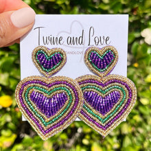 Load image into Gallery viewer, Mardi Gras accessories, Mardi gras earrings, beaded earrings, purple heart earrings, NOLA earrings, Mardi earrings, Purple earrings, Mardi Gras king cake beaded earrings, trendy earrings, party earrings, New Orleans party earrings, Mardi gras party earrings, holiday earrings, luxury earrings, Mardi gras accessories, Mardi Gras gifts, Mardi Gras New Orleans earrings, custom earrings, handmade earrings, Mardi Gras beaded earrings, Mardi Gras accessories, boho earrings, custom earrings, best selling items