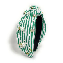 Load image into Gallery viewer, Green and white striped headband with a central knot, adorned with pearls and rhinestones, creating an elegant and playful look.