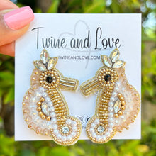 Load image into Gallery viewer, custom beaded Earrings, seahorse jeweled Earrings, seahorse Beaded Earrings, summer jeweled earrings, handmade earrings, custom earrings, party accessories, beach accessories, seahorse embellished earrings, custom earrings, best friend gifts, birthday gifts, bohemian earrings, luxurious handmade accessories, beach jewelry, Fancy earrings, boho earrings, beaded earrings, Fancy jeweled earrings, statement earrings, best selling items, seahorse accessories, handmade gifts, custom gifts, gold white earrings