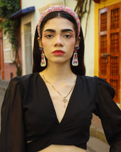 Load image into Gallery viewer, Woman wearing "It's My Birthday" earrings with a black top and white pants with jewelry outdoors.