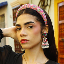 Load image into Gallery viewer, Woman wearing "It's My Birthday" earrings with a black top and white pants with jewelry outdoors.