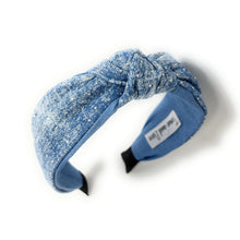 Load image into Gallery viewer, Blue denim headband with a knot design and small scattered rhinestones for sparkle, conveying a chic style.