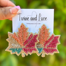 Load image into Gallery viewer, maple beaded Earrings, autumn Earrings, Autumn leaf Earrings, Fall Earrings, earrings for Thanksgiving, Thanksgiving earrings, orange earrings, Unique earrings, maple leaf earrings, Autumn jewelry, statement earrings, Brown earrings, Fall beaded earrings, Autumn jewelry, Holiday earrings, pumpkin earrings, custom designs, maple earrings, dangling earrings, unique earrings, Thanksgiving accessories, Autumn accessories, Autumn brown earrings, Fall accessories, best selling fall earrings