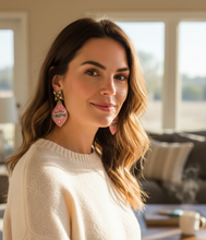 Load image into Gallery viewer, Woman wearing a cream sweater with pink earrings in a living room setting