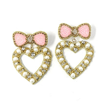 Load image into Gallery viewer, heart with bow jeweled Earrings, pink bow heart valentines Earrings, Valentines Day Earrings, Valentines Beaded Earrings, Valentines Heart earrings, sweetheart earrings, valentine’s day beaded earrings, dainty valentines beaded earrings, valentines beaded earrings, unique earrings, Valentine’s day earrings, tween girls accessories, Valentine’s day accessories, Best selling items, Valentines accessories, pearly heart earrings, custom earrings, gifts for her, handmade gifts, unique valentines heart earrings