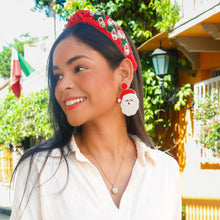 Load image into Gallery viewer, Woman wearing a white shirt, red headband and Santa Claus beaded earrings