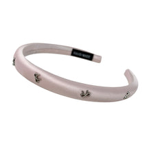 Load image into Gallery viewer, Pink headband with small silver bow decorative charms on a white background