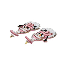 Load image into Gallery viewer, Beaded snowman earrings featuring pink hats and scarves, with black arms and vibrant orange noses. The design conveys a playful, festive tone.