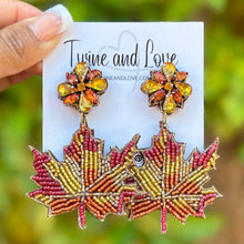 Load image into Gallery viewer, maple beaded Earrings, autumn Earrings, Autumn leaf Earrings, Fall Earrings, earrings for Thanksgiving, Thanksgiving earrings, orange earrings, Unique earrings, maple leaf earrings, Autumn jewelry, statement earrings, Brown earrings, Fall beaded earrings, Autumn jewelry, Holiday earrings, pumpkin earrings, custom designs, maple earrings, dangling earrings, unique earrings, Thanksgiving accessories, Autumn accessories, Autumn brown earrings, Fall accessories, best selling fall earrings