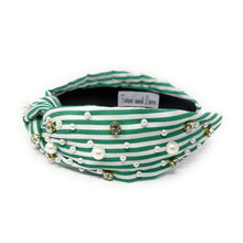 Load image into Gallery viewer, Green and white striped headband with a central knot, adorned with pearls and rhinestones, creating an elegant and playful look.