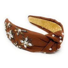 Load image into Gallery viewer, Brown headband adorned with pearl and crystal floral embroidery, exuding elegance. The interior is lined with soft beige fabric for comfort.