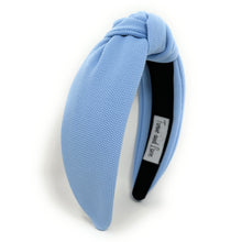 Load image into Gallery viewer, Woman accessorized with a soft blue fabric headband and artisan bird-shaped earrings, creating a playful yet sophisticated look.