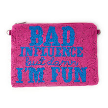 Load image into Gallery viewer, A pink clutch bag with blue beaded text reading &quot;Bad influence but damn I&#39;m fun.&quot; The words convey a playful and bold tone.