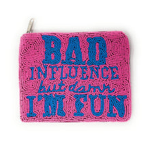 Load image into Gallery viewer, A pink clutch bag with blue beaded text reading &quot;Bad influence but damn I&#39;m fun.&quot; The words convey a playful and bold tone.