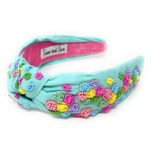 Load image into Gallery viewer, Woman wearing pastel rainbow “Be Kind” beaded earrings paired with a mint floral embellished headband for a cheerful playful look.