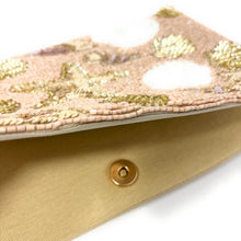 Load image into Gallery viewer, Coastal glam evening clutch decorated with shimmering seashell and starfish sequin details.