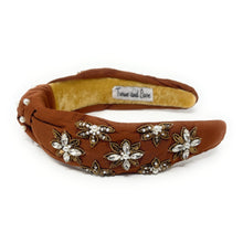 Load image into Gallery viewer, Brown headband adorned with pearl and crystal floral embroidery, exuding elegance. The interior is lined with soft beige fabric for comfort.