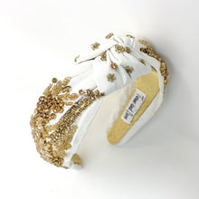 Load image into Gallery viewer, White headband with gold embellishments on a white background