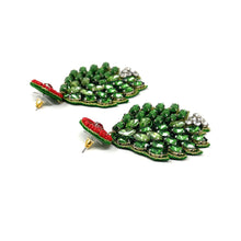 Load image into Gallery viewer, Dangling earrings feature vibrant green gemstones shaped like leaves with a red circular top. A small cluster of white stones accent the bottom. Festive and elegant.