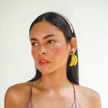 Load image into Gallery viewer, Close-up portrait of a beauty model wearing striking earrings.
