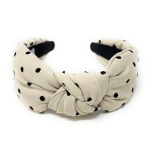 Load image into Gallery viewer, Beige headband with black polka dots on a white background