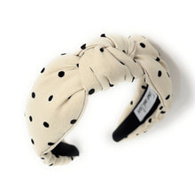 Load image into Gallery viewer, Beige headband with black polka dots on a white background