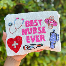 Load image into Gallery viewer, Hand beaded pouch with the words &quot;Best Nurse Ever&quot; and images of a stethoscope, heart, thermometer, bandage, and blood pressure monitor, celebrating healthcare.