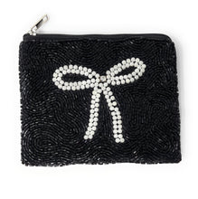 Load image into Gallery viewer, Elegant black beaded coin purse with a large white pearl bow on the front.