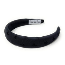 Load image into Gallery viewer, Elegant black fabric headband with subtle bow pattern. Minimalist and chic.