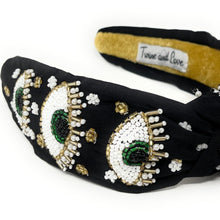 Load image into Gallery viewer, Handcrafted evil eye headband in black with intricate bead embroidery, rhinestones, and decorative pearls.