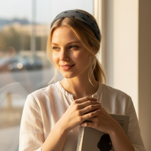 Load image into Gallery viewer, Woman wearing a headband and holding a book by a window