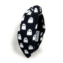 Load image into Gallery viewer, Five Halloween-themed headbands with different patterns: spider webs on black, candy corn, plaid, jack-o&#39;-lanterns on orange, and ghosts on black.