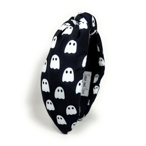 Five Halloween-themed headbands with different patterns: spider webs on black, candy corn, plaid, jack-o'-lanterns on orange, and ghosts on black.