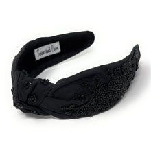 Load image into Gallery viewer, Elegant black headband with intricate beadwork, featuring small, glossy beads. It has a label inside reading "Twine and Love," suggesting a touch of luxury.