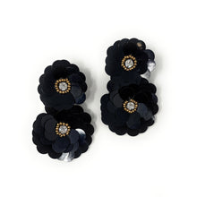 Load image into Gallery viewer, Black flower-shaped earrings with gemstone centers on a white background