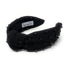 Load image into Gallery viewer, Black fabric headband adorned with small black beads, featuring a knotted design in the center. 
