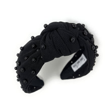 Load image into Gallery viewer, Black fabric headband adorned with small black beads, featuring a knotted design in the center. 
