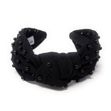 Load image into Gallery viewer, Black fabric headband adorned with small black beads, featuring a knotted design in the center. 