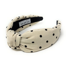Load image into Gallery viewer, Beige headband with black polka dots on a white background
