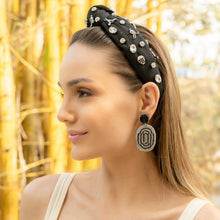 Load image into Gallery viewer, Woman wearing a decorative headband and earrings with a blurred natural background