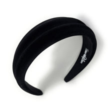 Load image into Gallery viewer, A black, velvet headband with a wavy padded design. It has a luxurious appearance and classic style, set against a plain white background.