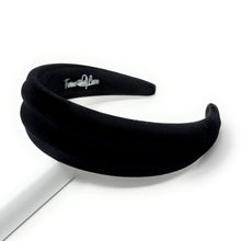 Load image into Gallery viewer, Black velvet headband with a brand logo on a white background